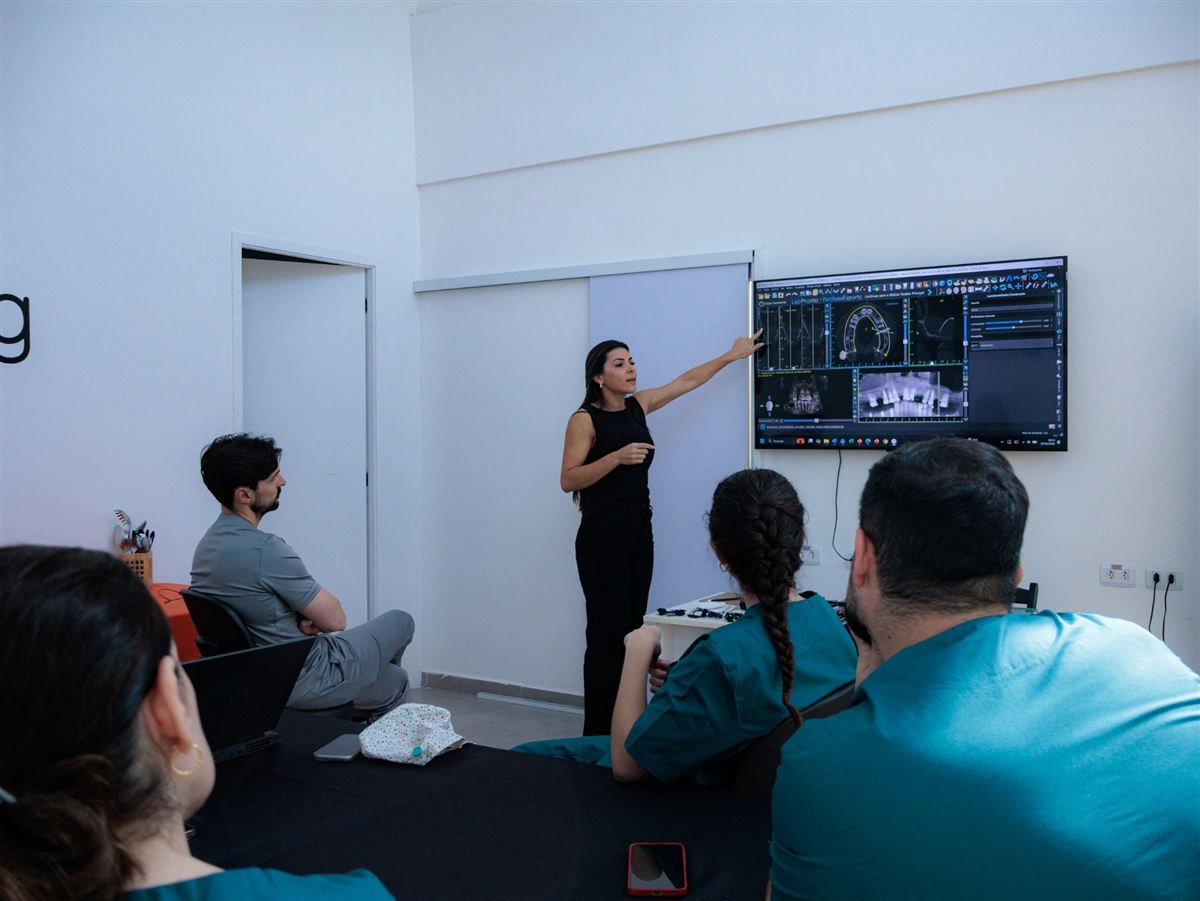 Dr. Marcela Lopes reviewing a case